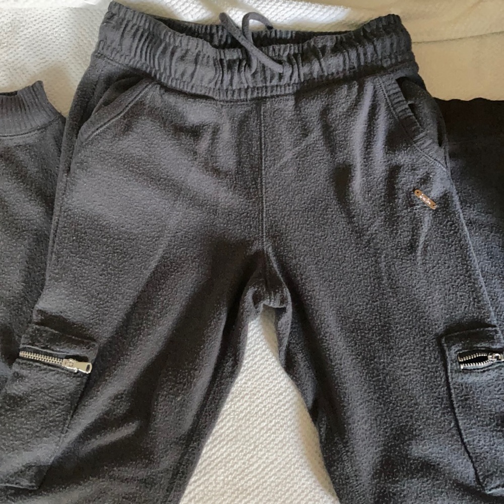 Grey joggers with silver zipper detail